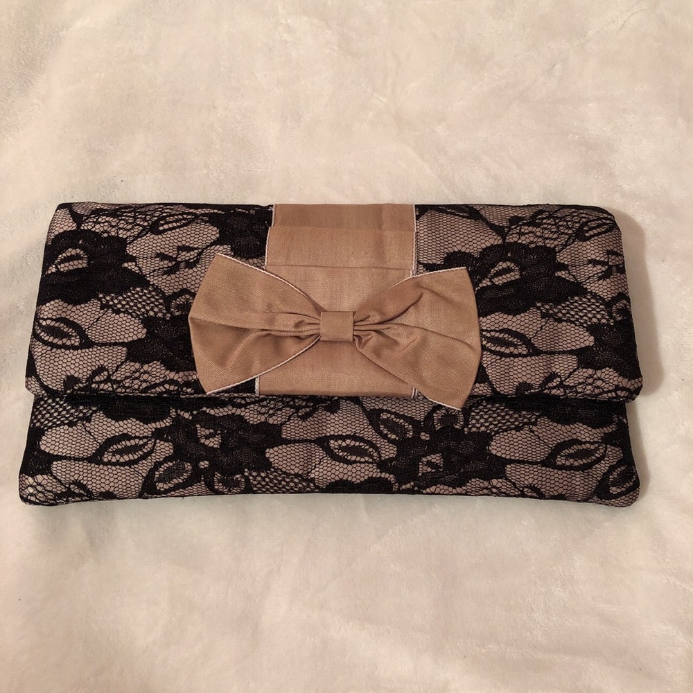 Percy beige and black lace clutch with bow